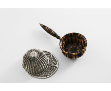A VICTORIAN TONBRIDGE-WARE CADDY SPOON in the form of a scoop or ladle, c.1860 and a George III filigree caddy spoon in the f