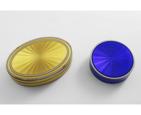 AN EARLY 20TH CENTURY CONTINENTAL SILVERGILT OVAL BOX AND COVER decorated with translucent yellow enamel over an engine-turne