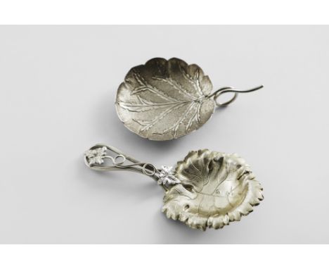 A VICTORIAN PARCELGILT CADDY SPOON with a leaf and tendril stem and a stamped leaf bowl, by George Unite, Birmingham 1855 and