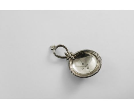 A GEORGE III SMALL CADDY SPOON with a shallow circular bowl and a ropework border and handle, decorated with small leaf motif
