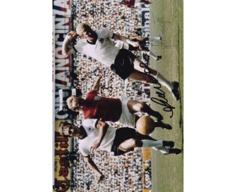 ENGLAND / WEST GERMANY      Col 12” x 8” photo, showing Francis Lee bustling his way through the West German defence during t
