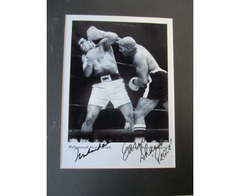 MUHAMMAD ALI- SHAVERS    Mounted black and white photograph of  Muhammad Ali avoiding a punch from Shavers and signed by both