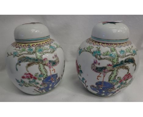 Pair of Chinese ceramic lidded ginger jars with bird and foliage decoration, each H: 16 cm. P&amp;P Group 3 (£25+VAT for the 