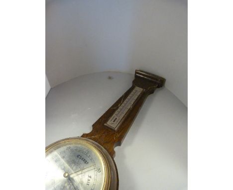 An Oak Banjo barometer A/F and one other