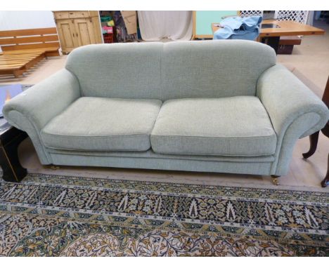 A Light Green two seater sofa