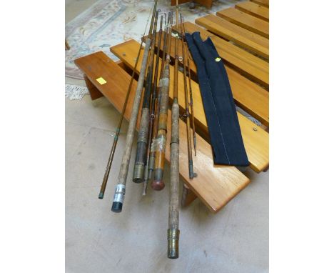 A quantity of various vintage fishing rods