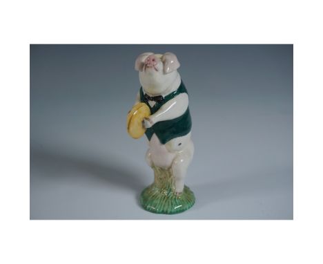 Charming Beswick pig figurine titled George, featuring the character standing upright on a grassy base while playing cymbals.