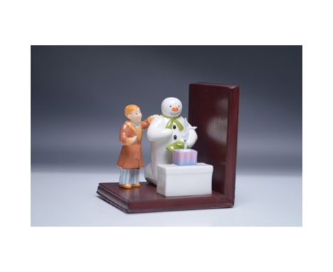 This charming porcelain bookend from Coalport's 2003 The Snowman series features the iconic Snowman and James, capturing a sc