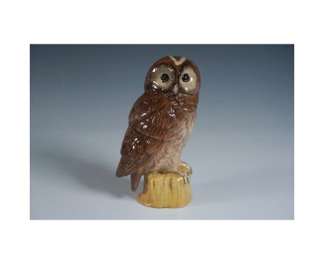 A charming ceramic whisky decanter by White &amp; Mackay, crafted in the form of a tawny owl perched on a stump. Measuring 6.