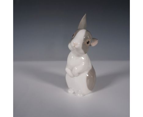 Nao by Lladro porcelain figurine featuring an endearing bunny in a lifelike seated pose with detailed hand-painted accents in
