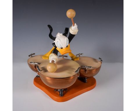 This delightful figurine from the Walt Disney Classics Collection, titled Donald's Drum Beat, features Donald Duck energetica