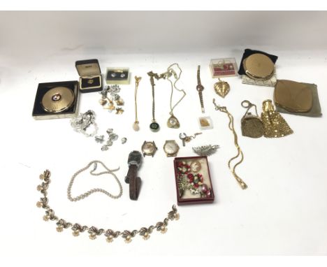 A collection of costume jewellery including vintage watches compact mirrors etc.