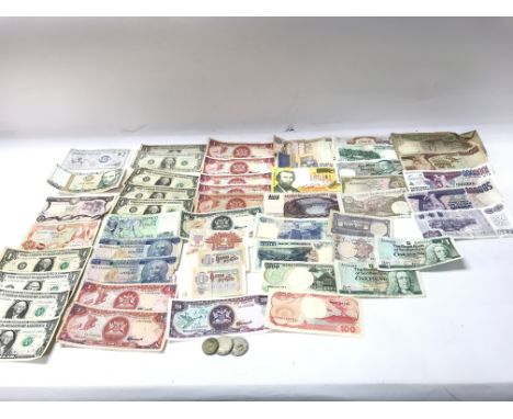 A collection of world bank notes including US dollars bank of Indonesia etc. Postage A