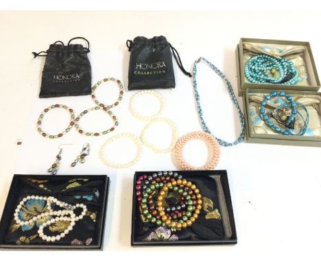 A collection of Honora pearl jewellery. Postage B