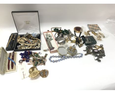 A collection of costume jewellery including watches necklaces compact etc.