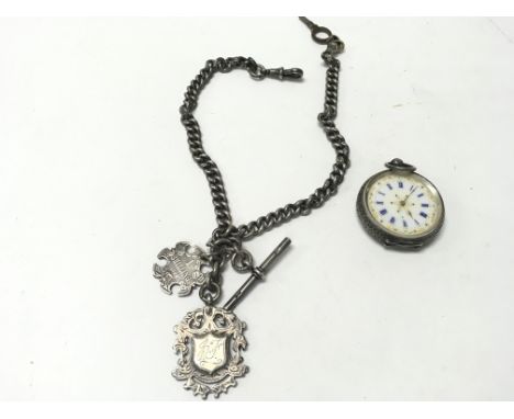 A silver pocket watch with enamel face winds and runs. Also a silver watch chain with silver fobs attached. Total weight 113g