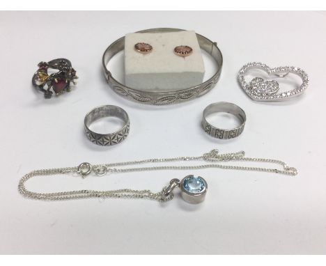 A small collection of silver jewellery comprising rings, bangle etc. Shipping category A.