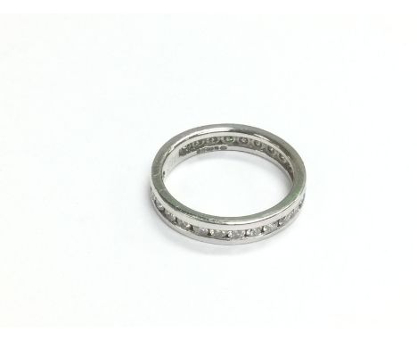 An 18ct white gold eternity ring, approx size J-K and approx 3g. Shipping category A.