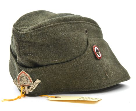 A Third Reich RAD grey/green sidecap,  with painted aluminium badge, the lining with maker’s stamp of Robert Lubstein (?) Ber