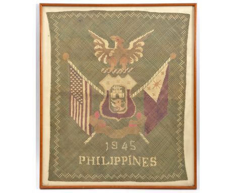 A WWII woven coloured raffia panel to celebrate the Liberation of the Philippine Islands, 1945, American eagle on shield and 
