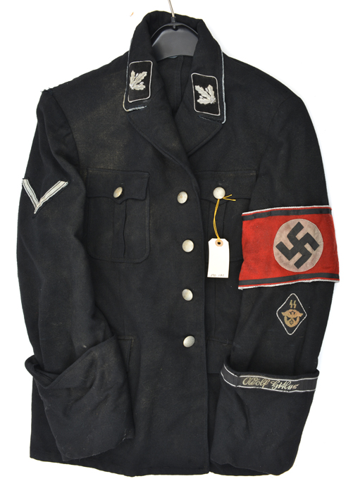 A Third Reich black tunic, with beaded silver buttons and SS insignia ...