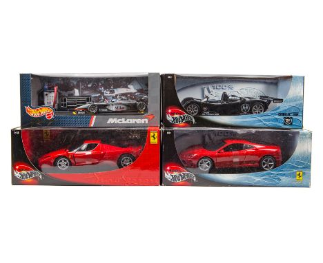 4 Hotwheels 1:18/1:24 cars. Ferrari Enzo and a Ferrari 360, both in race red. Plus a Cadillac LMP (Le Mans Prototype) in blac