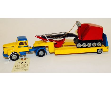 A Dutch Tekno Scania 110 Super normal control 6 wheeled tractor unit and 8 wheeled low-loader, with load. In blue & yellow li