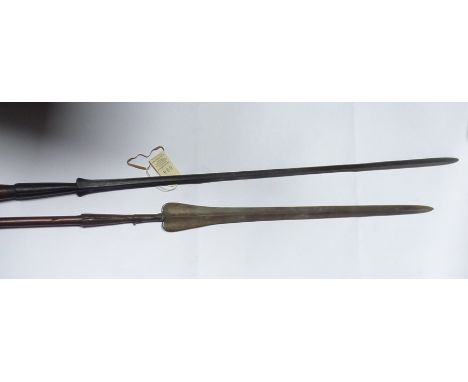 A Masai lion spear,  unusually long slender blade of traditional form but slightly swollen at point, 76” overall, and another