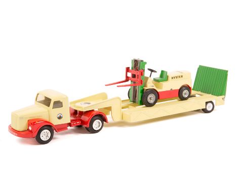 A rare Danish Tekno Scania-Vabis LS75 normal control low loader. In yellow, red and green Hyster Denmark livery, complete wit