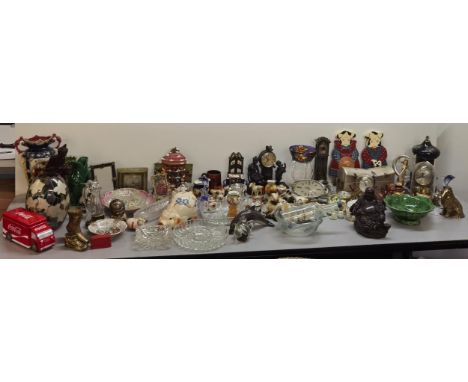 A mixed lot of ceramics and collectables to include picture plates, trinkets, clocks, ceramic figures of cats and dolphins an