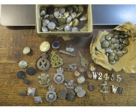 A collection of Bucks Constabulary and WWII Army cap badges including The Welsh and Royal Corps Army Ordnance, silver ARP bad