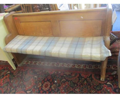 A light oak two seater bench with loose cushion seat, 84cm x 136cm x 42cmLocation: RAF 