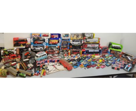 A mixed collection of toys to include boxed cars, Days Gone loose cars, Disney cars, Thomas the Tank Engine trains, and mixed