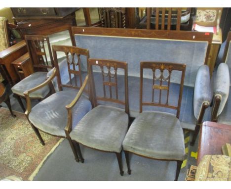 An Edwardian mahogany suite consisting of a sofa, armchair and five dining chairs, one a carverLocation: 