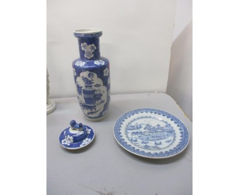 A 19th century blue and white shouldered vase decorated with a panel of jardinière stands and a vase of flowers to front and 