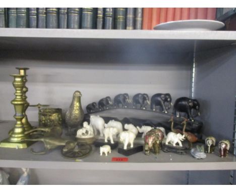 A mixed lot of brass and Indian and Asian ornaments to include an ebony and bone elephant train, Indian carved monkey group o