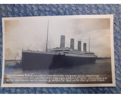 A vintage postcard album containing a Titanic postcard, HMS Hawke, HMS Iron Duke, other ships, Woolwich Arsenal, a postcard o