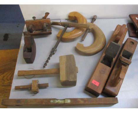 A quantity of woodworking tools to include large planes, clamps, spirit level and other itemsLocation: 