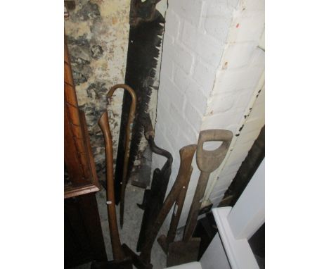 A mixed lot to include a saw, axe, walking stick and other items 