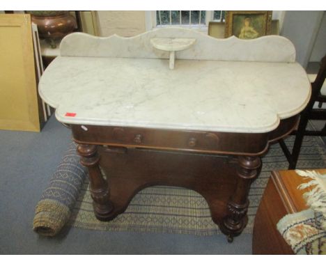 Victorian mahogany wash stand with extended marble top, single frieze drawer, turned front supports columns and flat pillar b