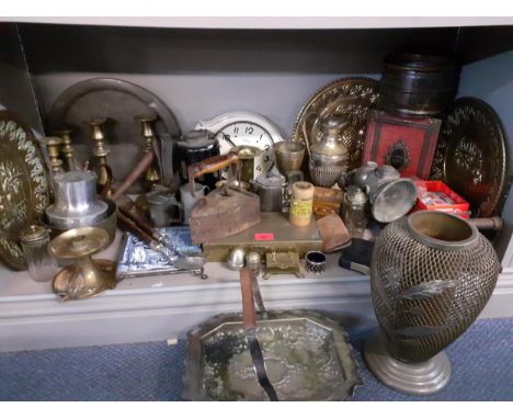 A vintage lot to include bicycle lamps, pewter and silver plate, brass candlesticks, a wall clock, a State Express cigarette 