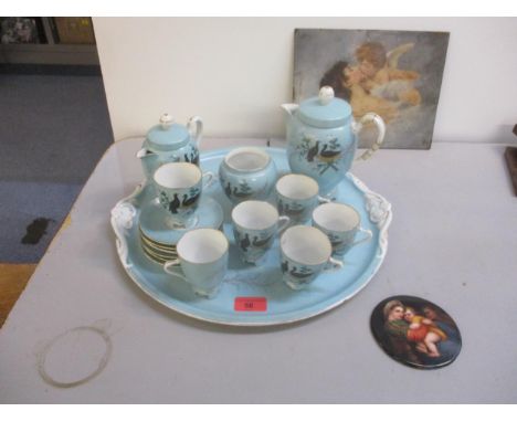 A late 19th century French porcelain cabaret set, a 19th century French porcelain medallion depicting a group of three childr