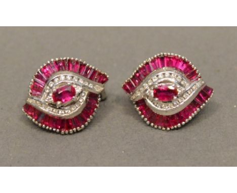 A Pair of 18ct. White Gold Ruby and Diamond Set Earstuds of Shaped Form 