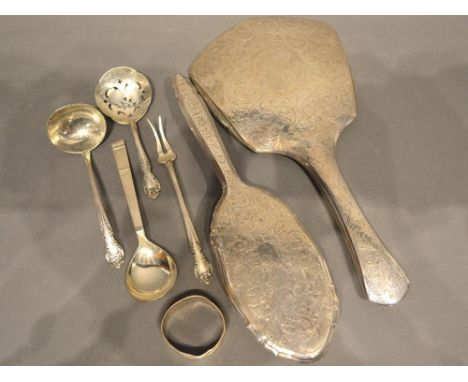 A Sterling Silver Backed Hand Mirror with matching Brush, together with three Silver Spoons, a Silver Pickle Fork and Silver 