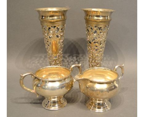 A Pair of Birmingham Silver Spill Vases of Pierced Form, together with a Sterling Silver Cream Jug and matching Sucrier 