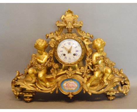 A 19th Century French Ormolu Mantle Clock, the enamel dial with Roman and Arabic numerals and inscribed Hall a Paris, the mov