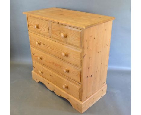 A Pine Chest of Two Short and Three Long Drawers with knob handles raised upon bracket feet, 91 cms wide, 45 cms deep, 91 cms