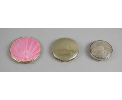 Pink guilloche enamel compact, with sunburst engine turned decoration, Birmingham 1937,another silver compact Birm, 1931 , an