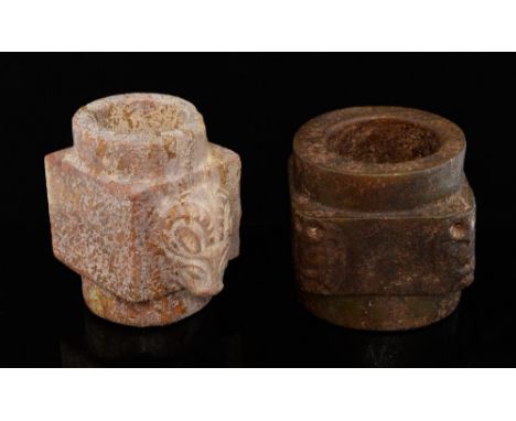Two Chinese jade Kong, one a reddish white with carved ram's head design, 11.5cm high, the other mottled green and brown carv