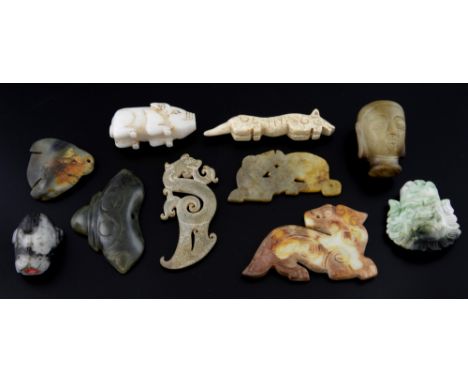 Ten pieces of carved jade to include a white jade pig, head of Buddha, three flat animals, and other items, (10), .  
